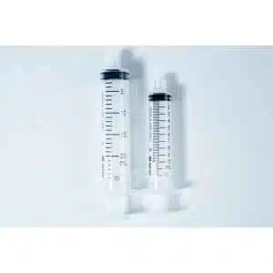 Two clear plastic syringes, one large and one small, placed side by side on a white background.