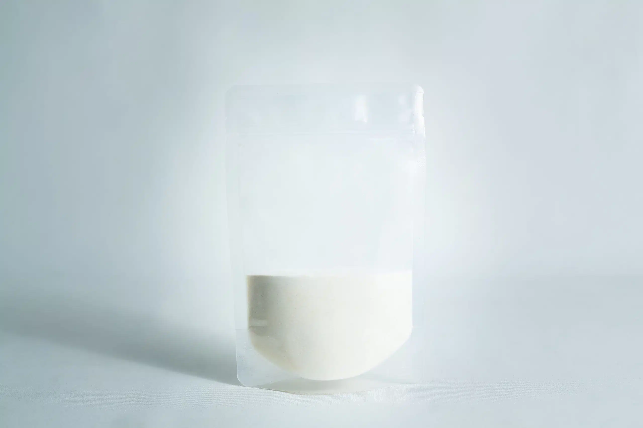 A clear resealable pouch, filled halfway with Agar Mix MYAG Antibacterial Malt Extract Yeast white powder, set against a plain white background.