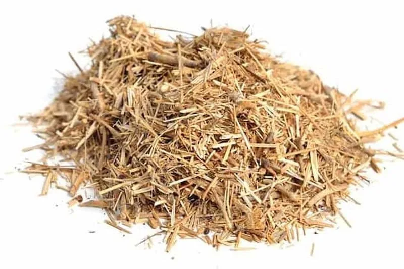 Hemp Hurd for Sale Australia-Mycomaterial, Hempcrete, animal bedding, mulch 1 A small pile of dried, shredded brown hemp hurd for sale Australia on a white background.