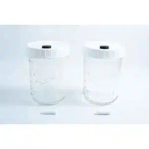 Two Mycology Ball mason jars, 1L each, genuine and autoclavable, with white lids featuring injection ports and air vents, displayed on a white background.