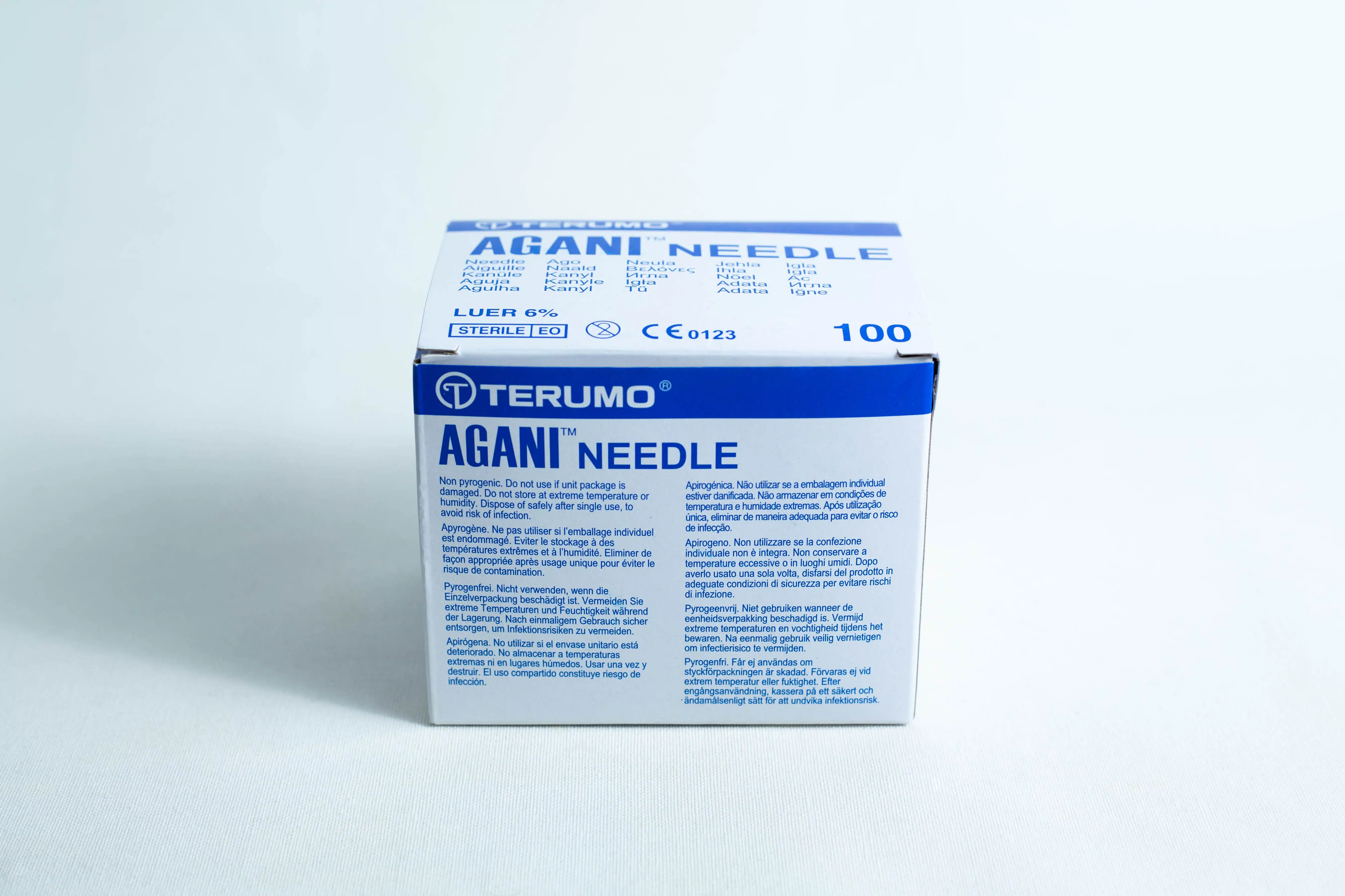 A box of sterile 18G hypodermic needles, whole box of 100pcs, featuring product details and blue text on a white background.
