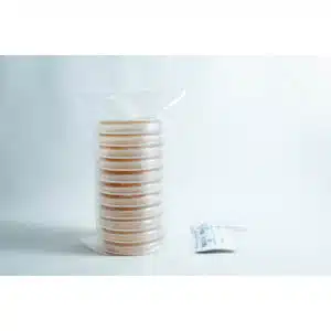Melbourne 4 A stack of pre-poured MEAG agar plates (antibacterial) 90mm, sealed in plastic, sits next to a small packet on a white surface.