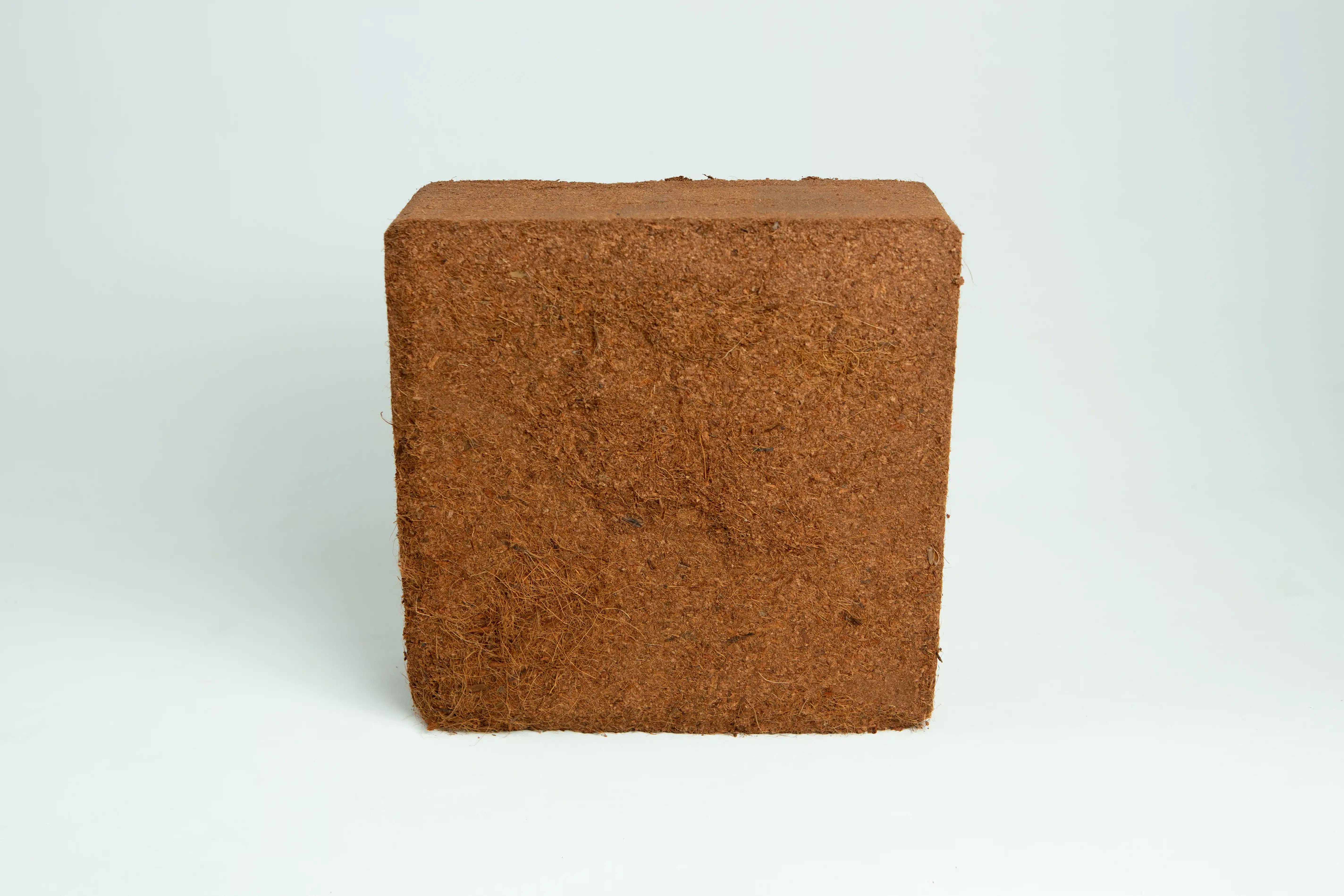 A 5 kg, 60L coco coir block (washed of salts, buffered RHP grade) is displayed against a plain white background.