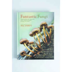 Book cover of Fantastic Fungi by Louie Schwartzberg, showing mushrooms sprouting from a log against a light background.