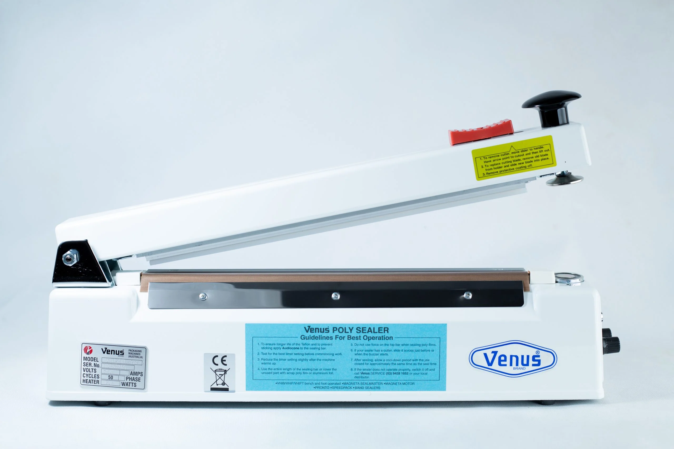 Heat Sealer 30cm Seal Width 5mm with cutter and Magnet 1 A white Heat Sealer 30cm with 5mm seal width, cutter, magnet, lever handle, and an instruction label on the side.