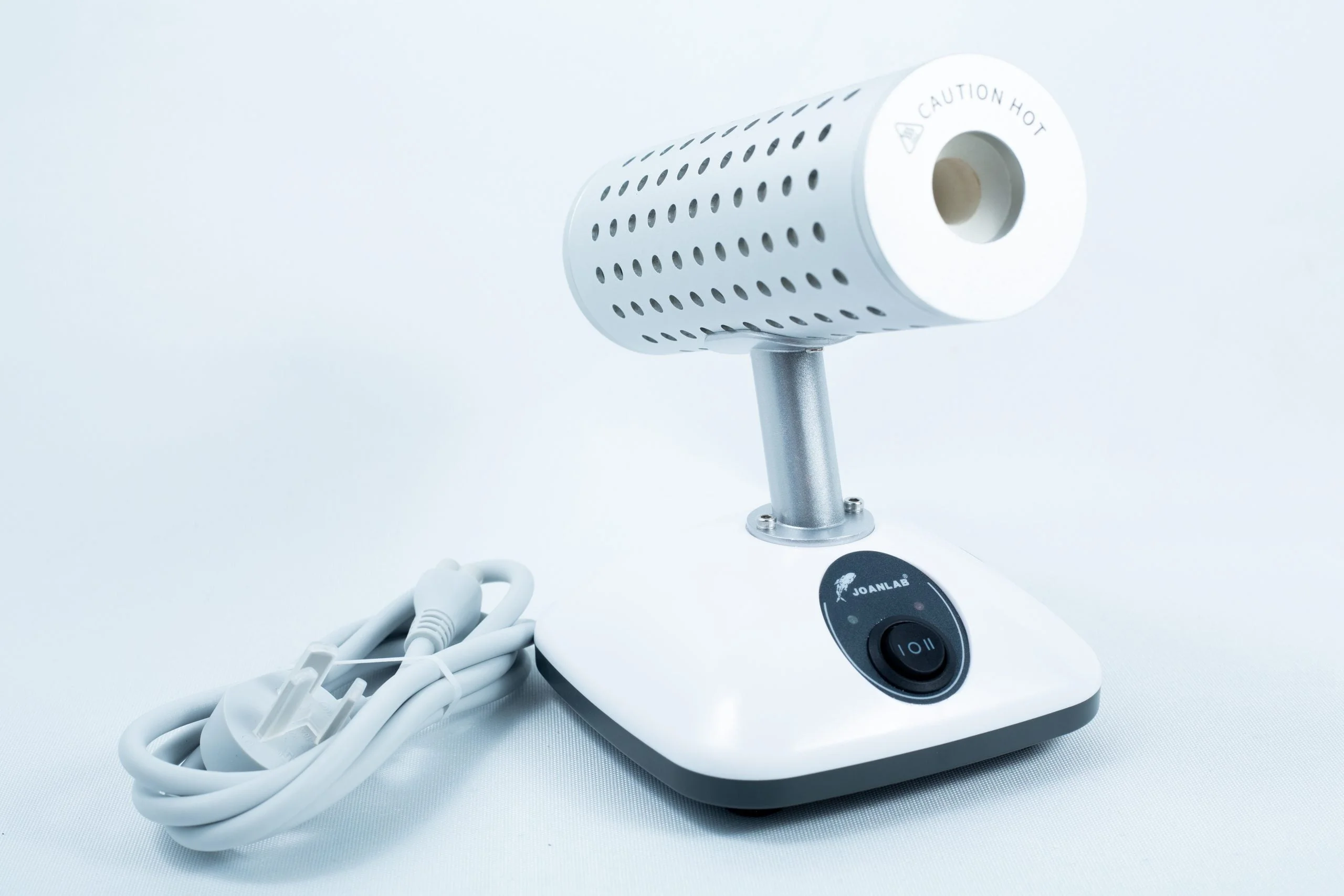 The Infrared Steriliser Bacti Cinerator Lab tool features a white base, power switch, and attached lead, providing efficient sterilisation for laboratory instruments.