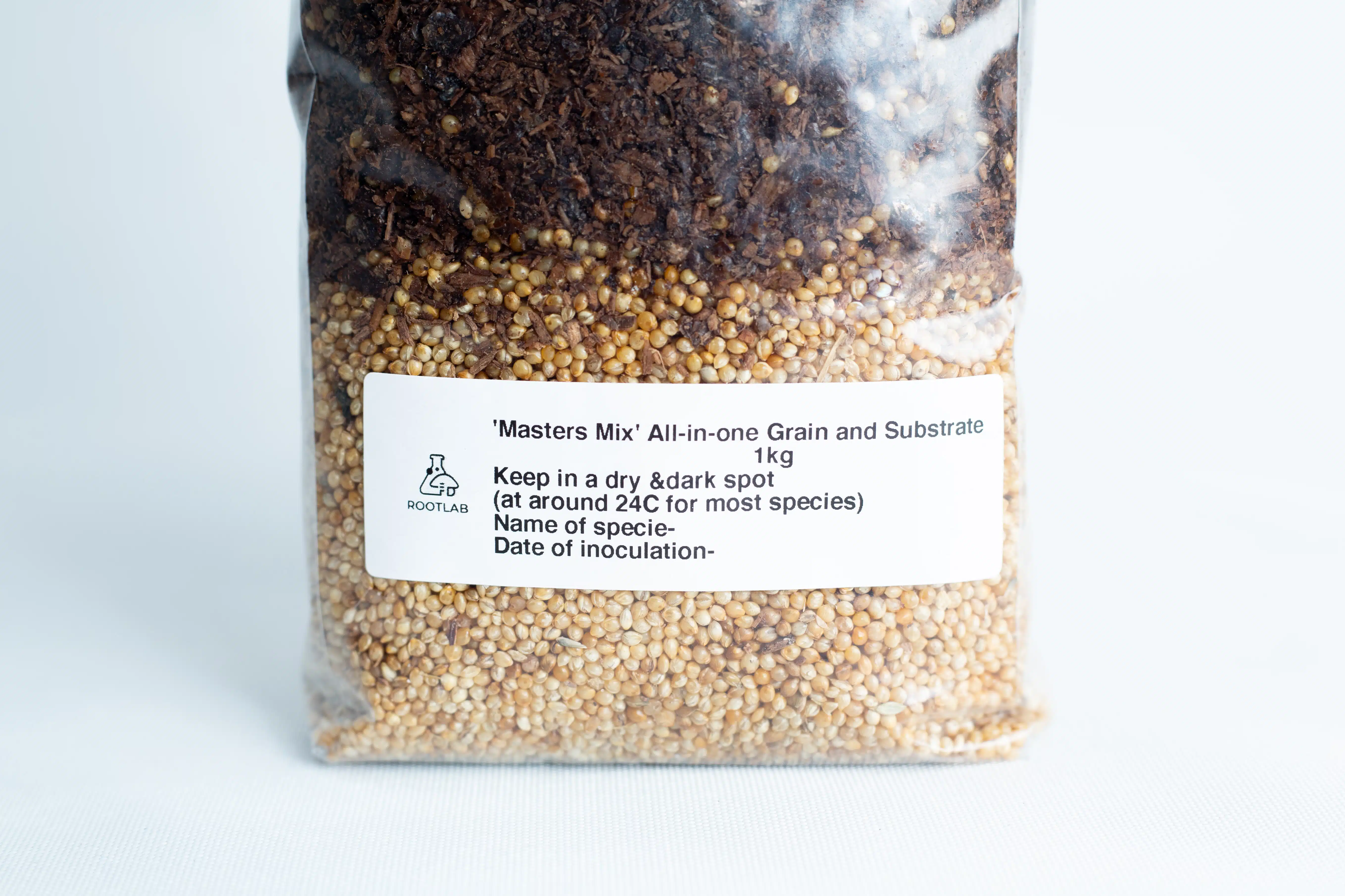 Pink Oyster Mushroom Grow Kit 5 Masters Mix + Millet All-in-one Mushroom 1kg Bag: Clear plastic bag with a white label containing storage and inoculation instructions, filled with a blend of grain and substrate.