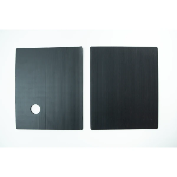 Two black rectangular mats, one with a circular hole, placed side by side on a white background—perfect for use with the Inflatable Monotub Kit for Growing Mushrooms - Boomer Shroomer V 2.0.