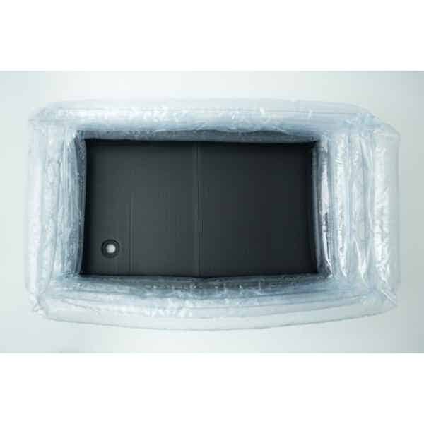 Top view of an empty inflatable monotub kit for growing mushrooms—Boomer Shroomer V 2.0—with a black rectangular base inside, resembling part of a mushroom grow kit.