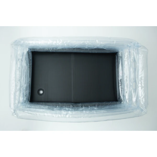 Top view of an empty inflatable monotub kit for growing mushrooms—Boomer Shroomer V 2.0—with a black rectangular base inside, resembling part of a mushroom grow kit.