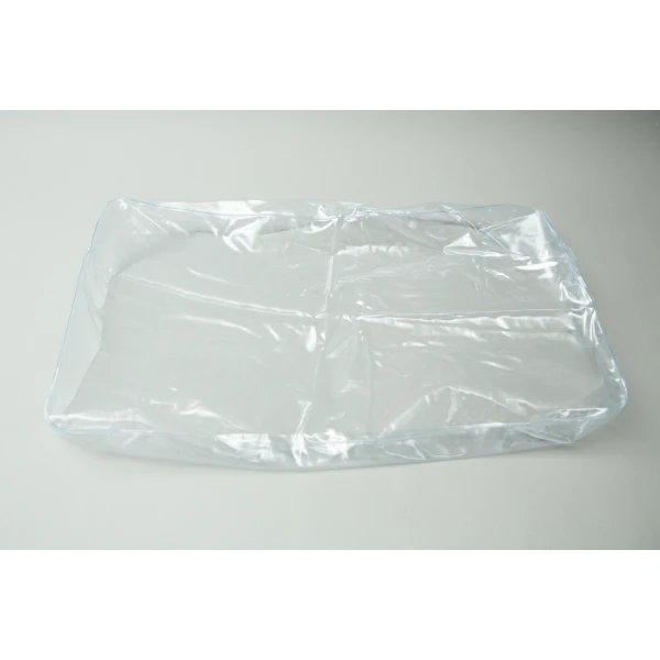 The Inflatable monotub kit for Growing mushrooms—Boomer Shroomer V 2.0—sits empty and transparent on a white surface, perfect for mushroom cultivation set-ups.