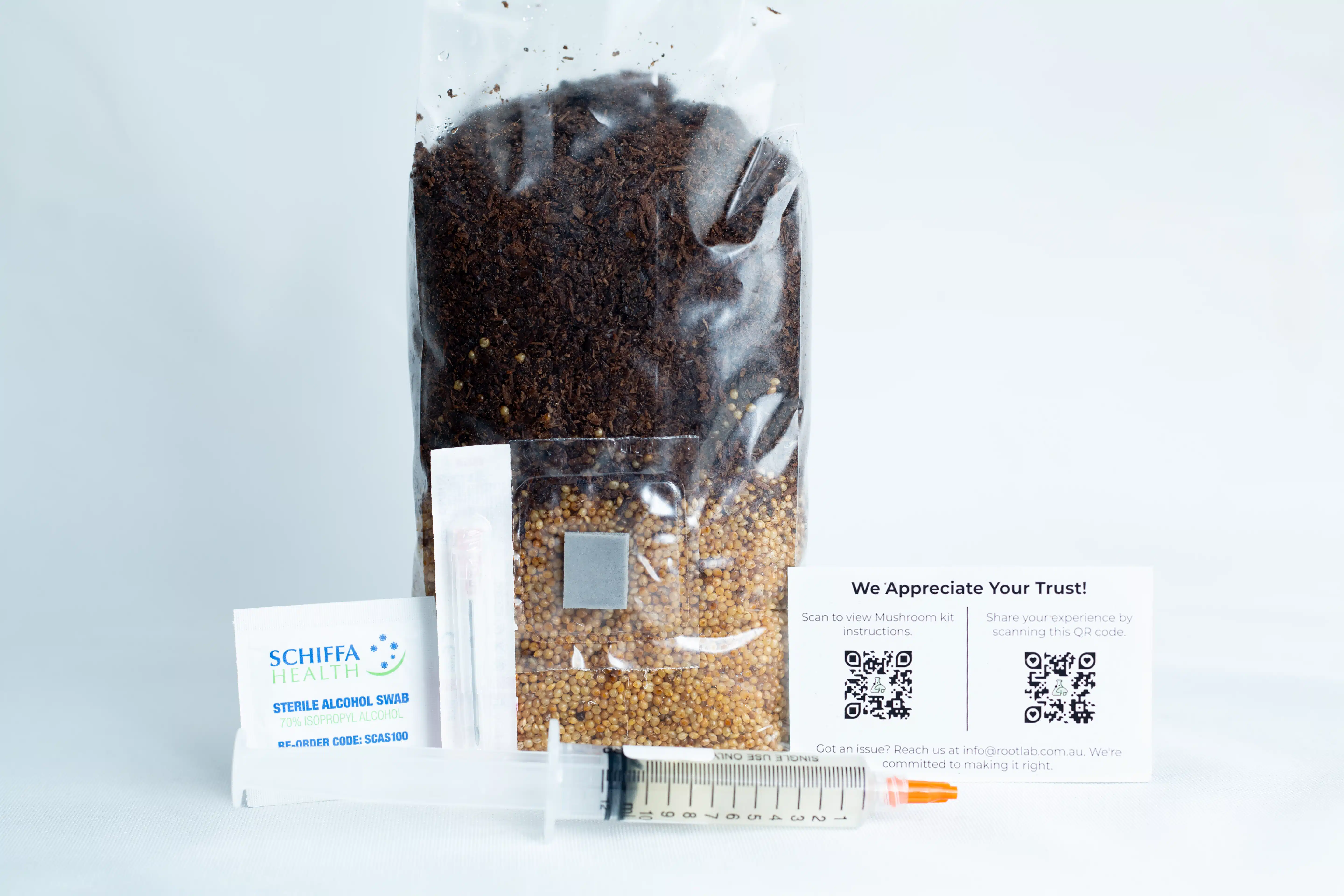 Pink Oyster Mushroom Grow Kit 2 The Black King Oyster Mushroom Grow Kit includes a sealed seed bag, syringe, alcohol swab, and two QR code cards, all shown on a white background.