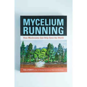 The cover of "Mycelium Running: How Mushrooms Can Help Save the World" by Paul Stamets features a forest and mushrooms—an essential mycology book for enthusiasts.