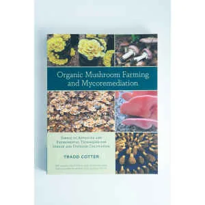 Book cover for "Organic Mushroom Farming and Mycoremediation: Book by Tradd Cotter," a top mycology book with mushroom photos and expert insights on mycoremediation.