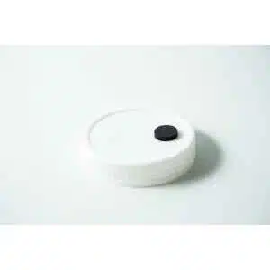 The Mycology premade Wide Mouth Mason Jar Lid is white with an injection port and air filter, featuring a textured surface—perfect as an autoclavable lid for liquid culture.