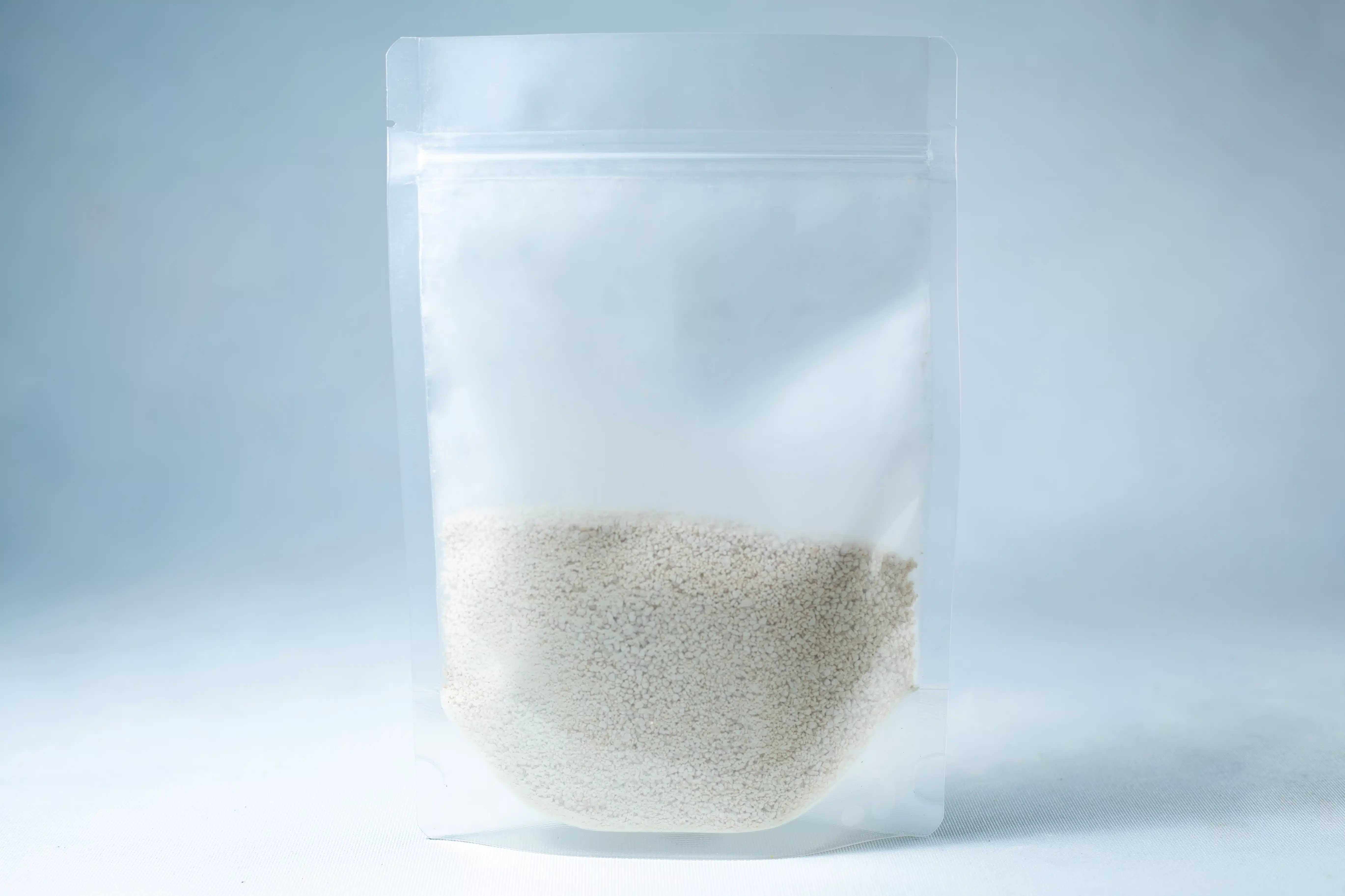 Potato Dextrose Agar powder -Lab Grade 1 A clear resealable plastic pouch containing Natural Gypsum coarse gradeโwhite granules used as a mushroom supplement for grain and substrateโstands upright on a light background.