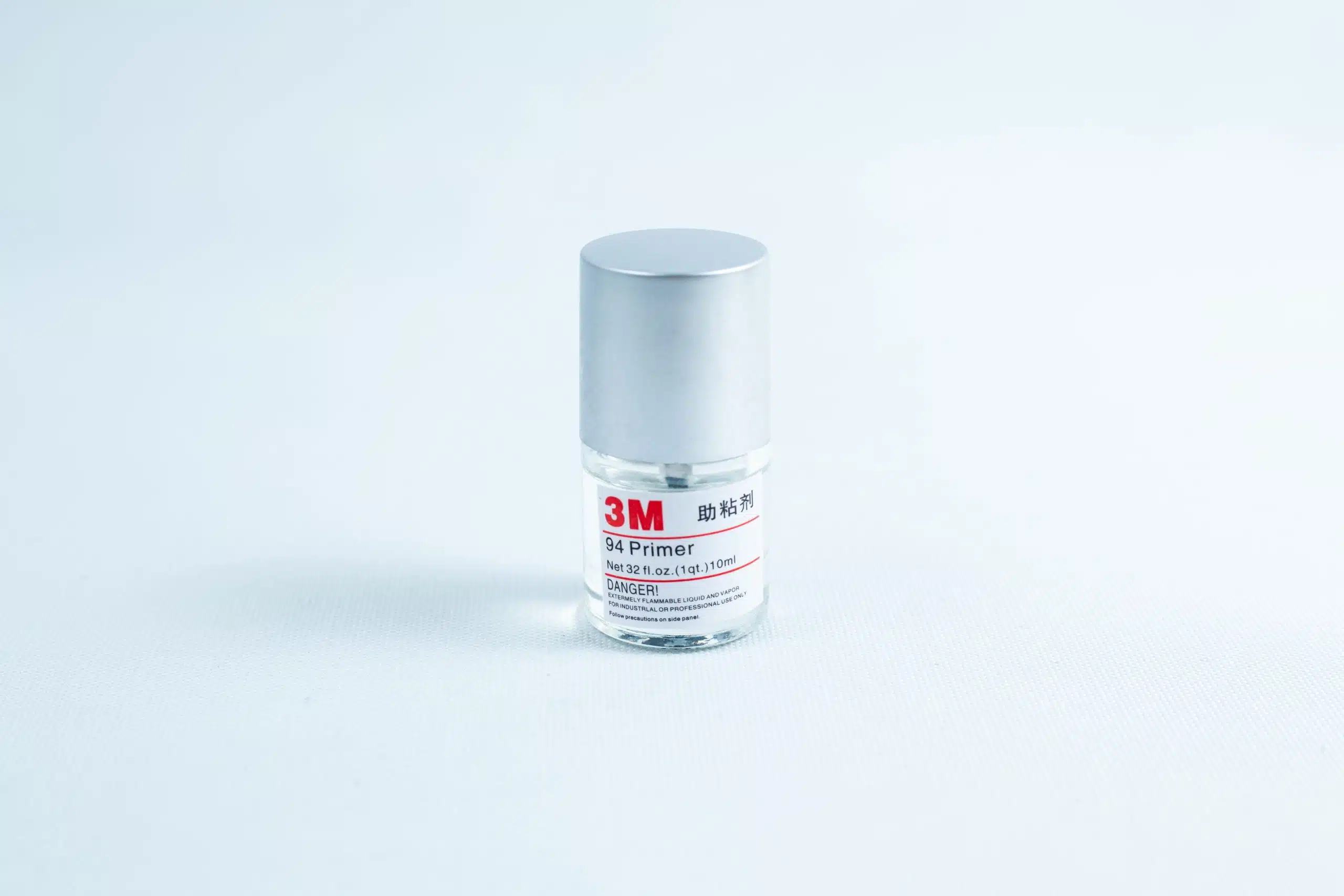 Primer 94 multisurface for 3M glue, 10ML bottle with silver cap on a white background—perfect as a tape primer for 3M adhesive applications.