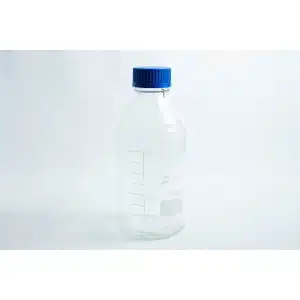 A Reagent bottle 1000ml made of clear glass with measurement markings and a blue screw cap.