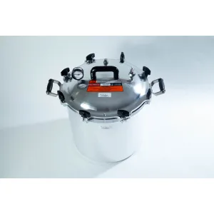 A large stainless steel pressure cooker with a black handle and pressure gauge on a white background.