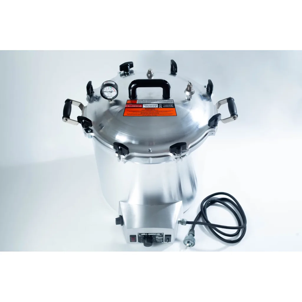 Large stainless steel pressure cooker with a gauge, black handles, and an attached power lead.