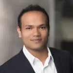 Growing Wood Blewit Mushrooms, Clitocybe nuda, formerly known as Lepista nuda in Australia 3 Portrait of a man in a dark suit and white shirt, smiling with a blurred background.