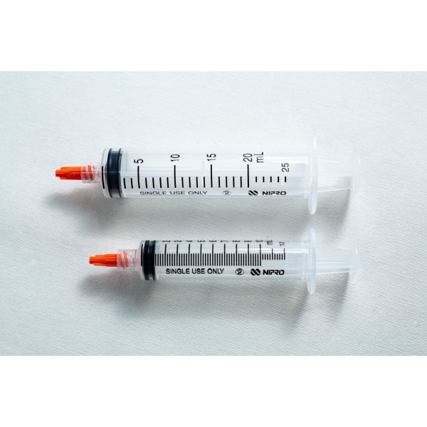 Photo Showing 10ml and 20 ml Empty Syringes with caps