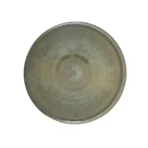 A round, empty, weathered metal plate viewed from above against a white background.