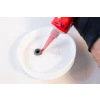 This picture shows high temperature RTV Silicon being applied on a Liquid culture Jar's lid to seal any gaps.