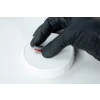 This picture shows high temperature RTV Silicon being applied on an injection port of a Liquid culture Jar's lid to seal any gaps.