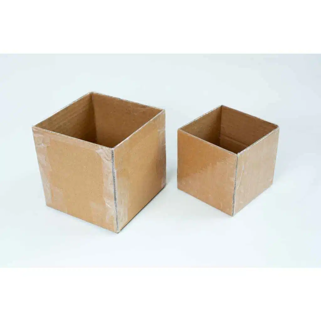 Two empty cardboard boxes of different sizes on a white background.