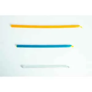 Three colourful twist ties, orange, blue, and clear, are laid out horizontally on a white background.