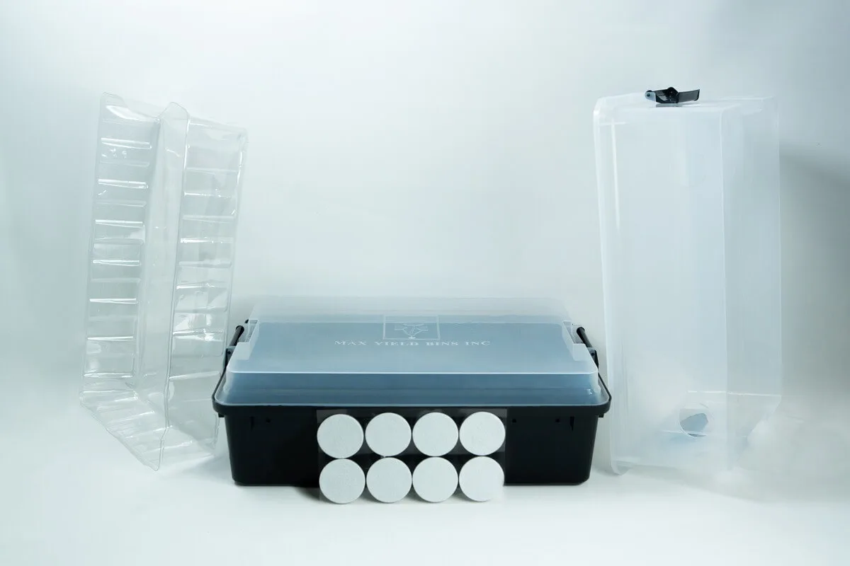 A plastic tub, two clear trays, eight round discs, and a tall clear container on a white background.