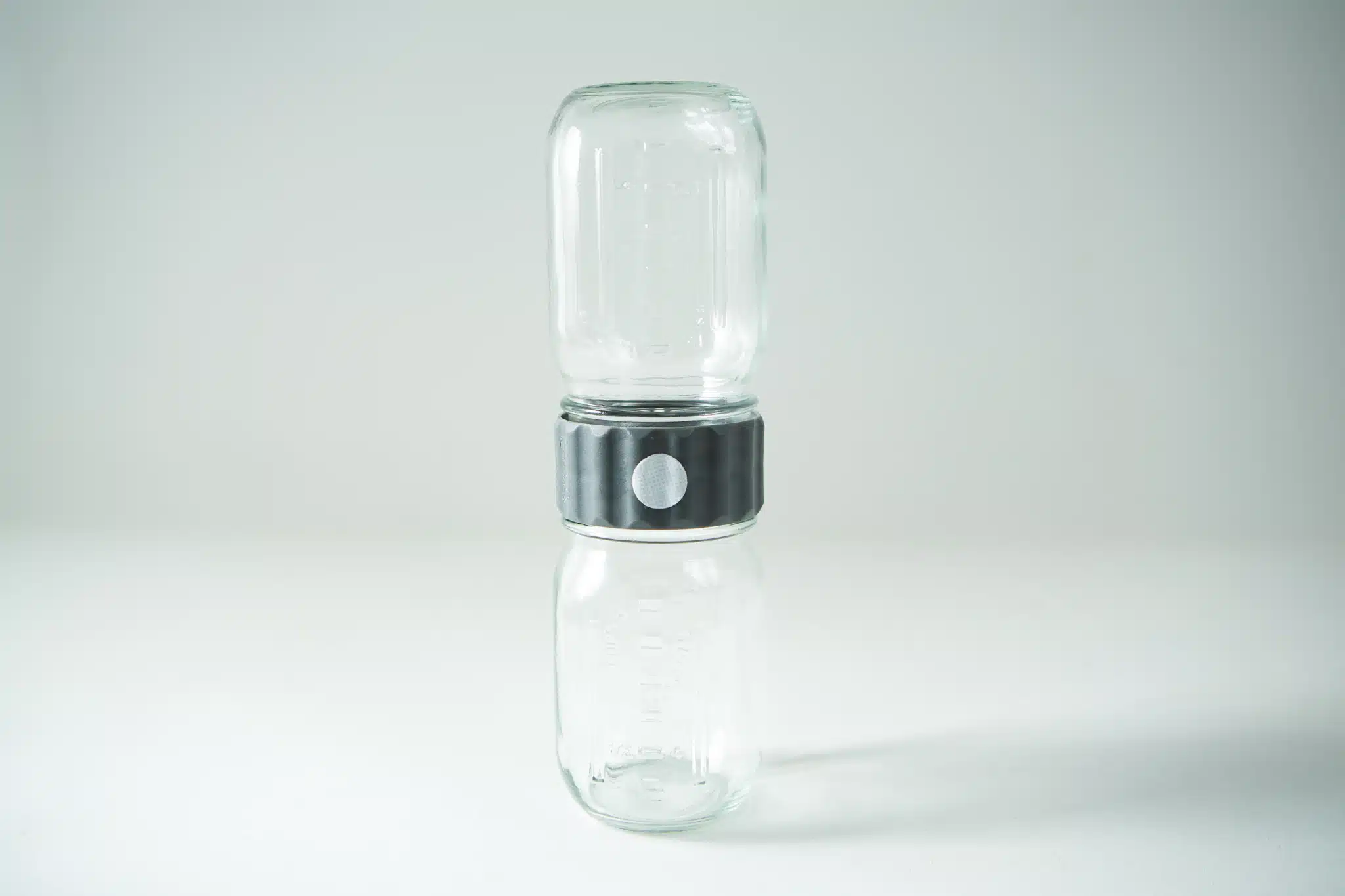 The Plant Cell Biocoupler™ Glass Set (470ml, 355ml, 235ml) features two glass jars vertically joined at their openings with a metal connector, shown against a plain background.