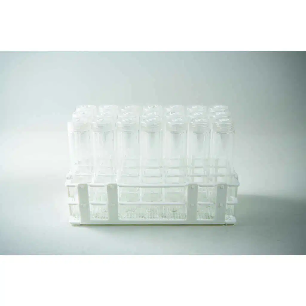 The Plant Cell Vented Plant TC Test Tubes with rack 12pc features a white plastic rack holding multiple clear test tubes with lids, displayed against a plain background.