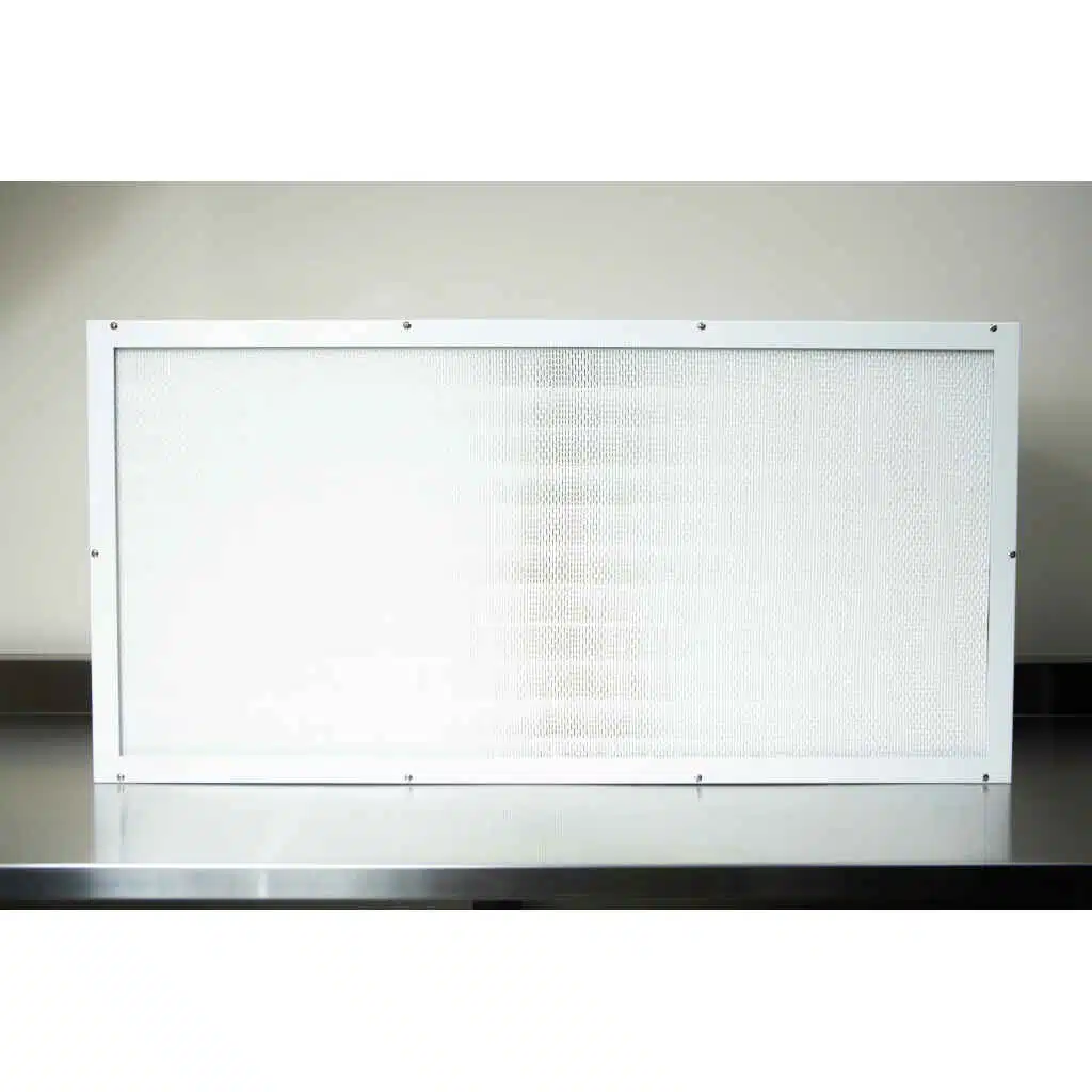 The Laminar Flow Hood H14 with pre-filter (120x60x35cm) features a rectangular white-framed air filter, shown on a metallic surface against a light background.