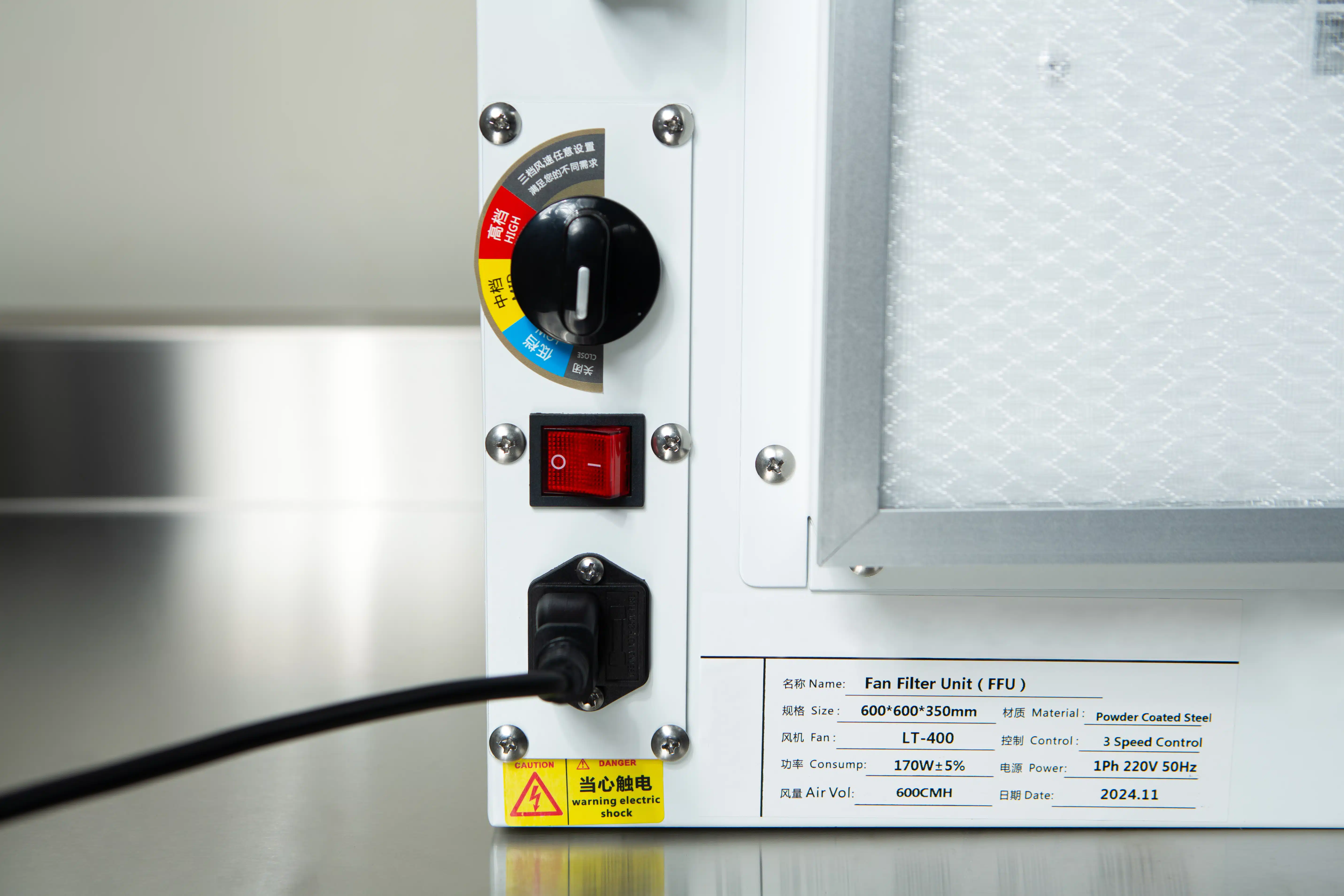 Laminar Flow Hood HEPA Airfilter H14 w/prefilter 60x60x35cm 2 Close-up of the Laminar Flow Hood HEPA Airfilter H14 with prefilter 60x60x35cm control panel, showing warning labels, knobs, switches, and a connected power lead.