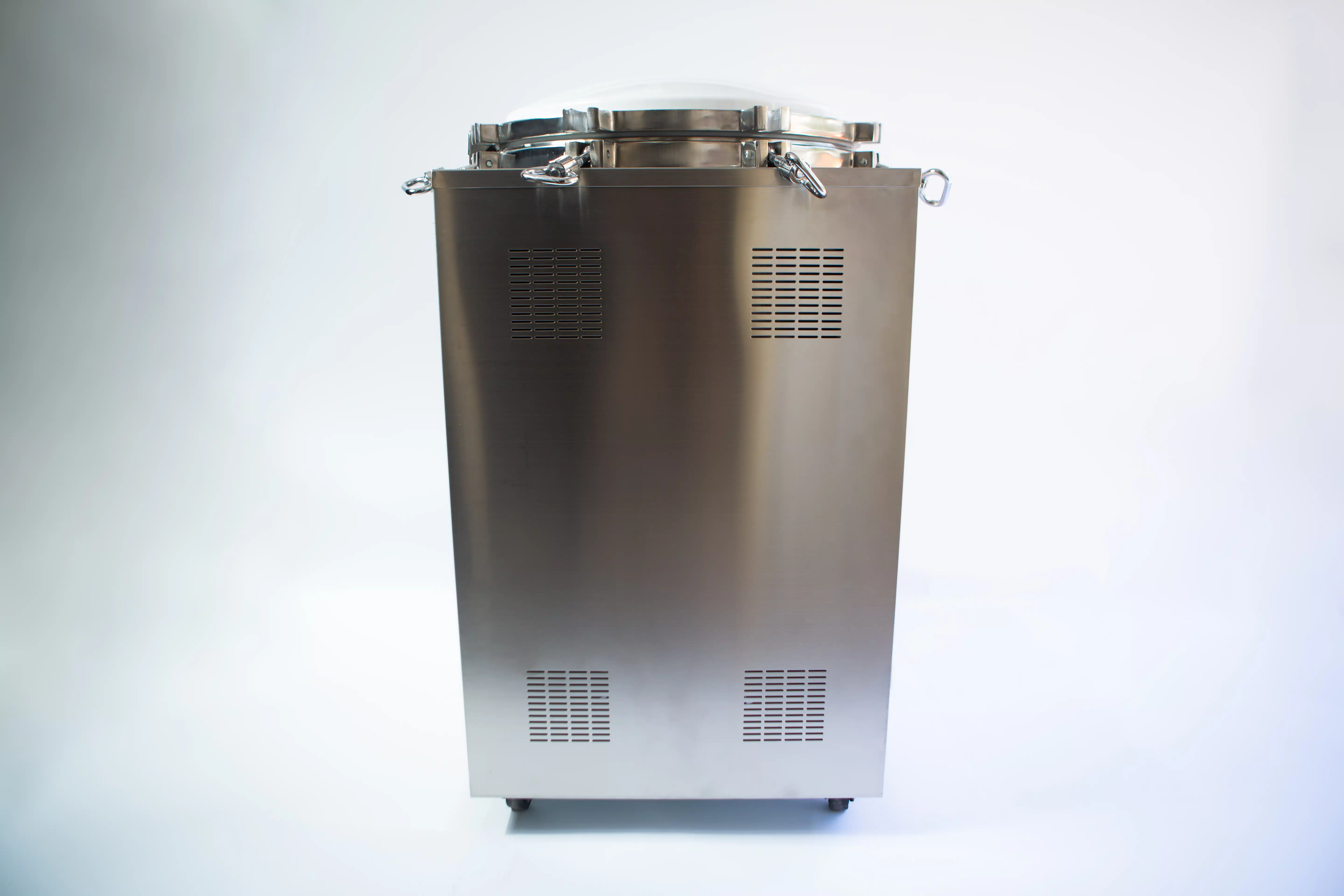 Vertical Autoclave 150 Liters (Automatic) | Commercial use | 6KW 5 Stainless steel industrial autoclave with a closed lid and ventilation grilles, standing on a white background.