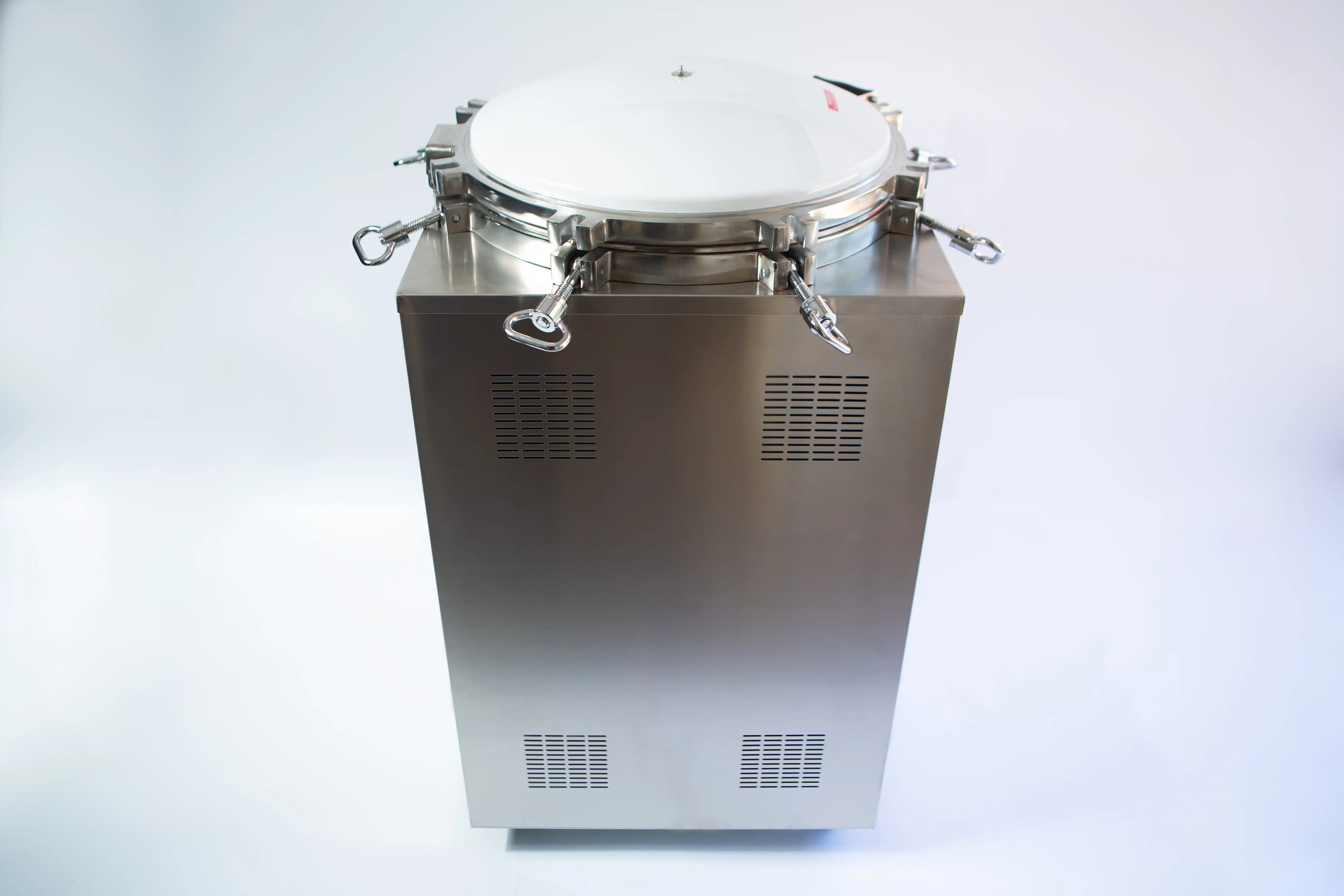 Vertical Autoclave 150 Liters (Automatic) | Commercial use | 6KW 4 A stainless steel autoclave machine with a round, sealed lid and catches on a plain background.