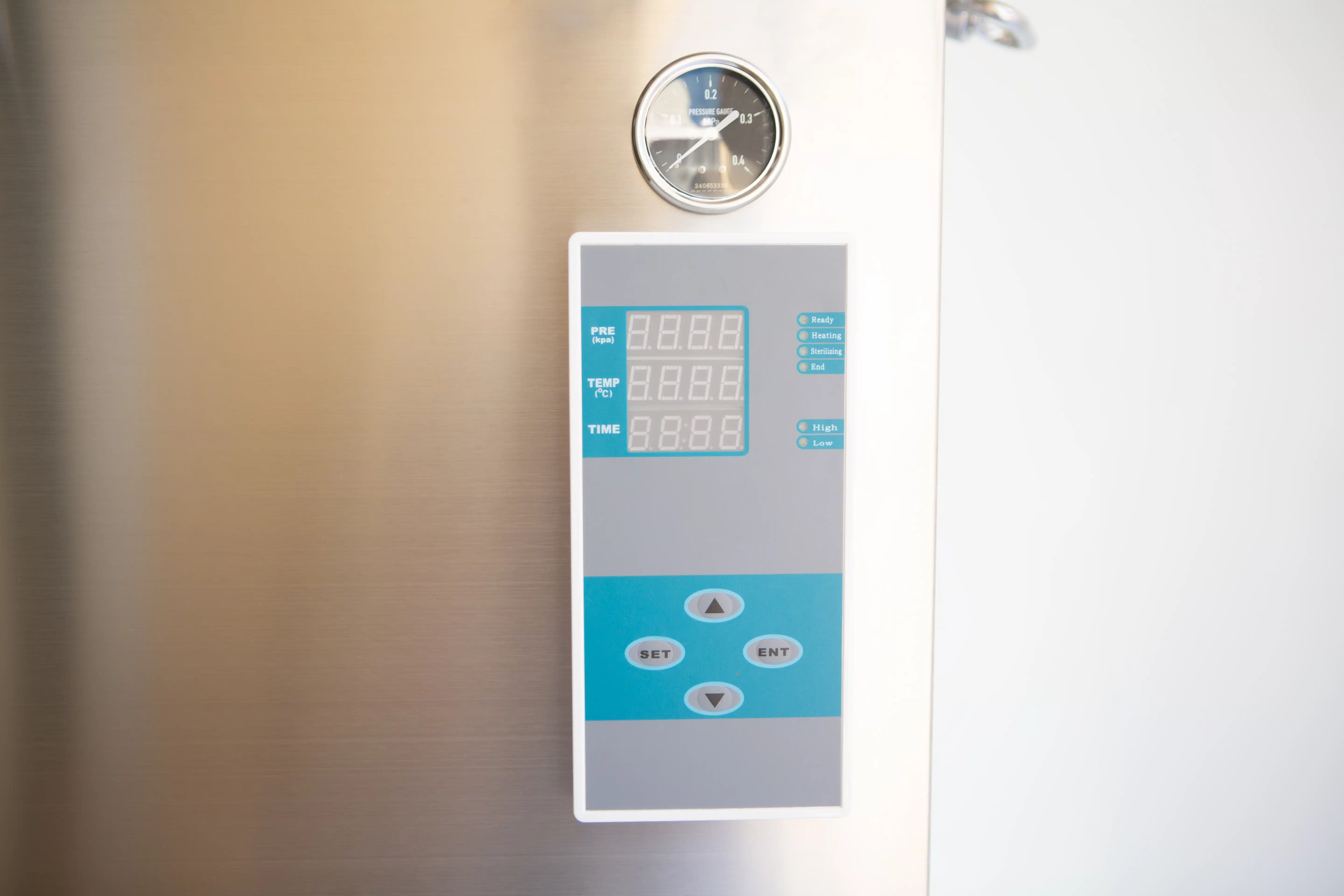 Vertical Autoclave 150 Liters (Automatic) | Commercial use | 6KW 3 Close-up of a digital control panel and gauge on a stainless steel appliance.