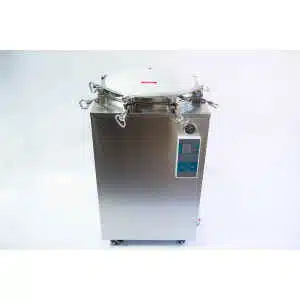 A stainless steel autoclave machine with a round lid and digital control panel on a white background.
