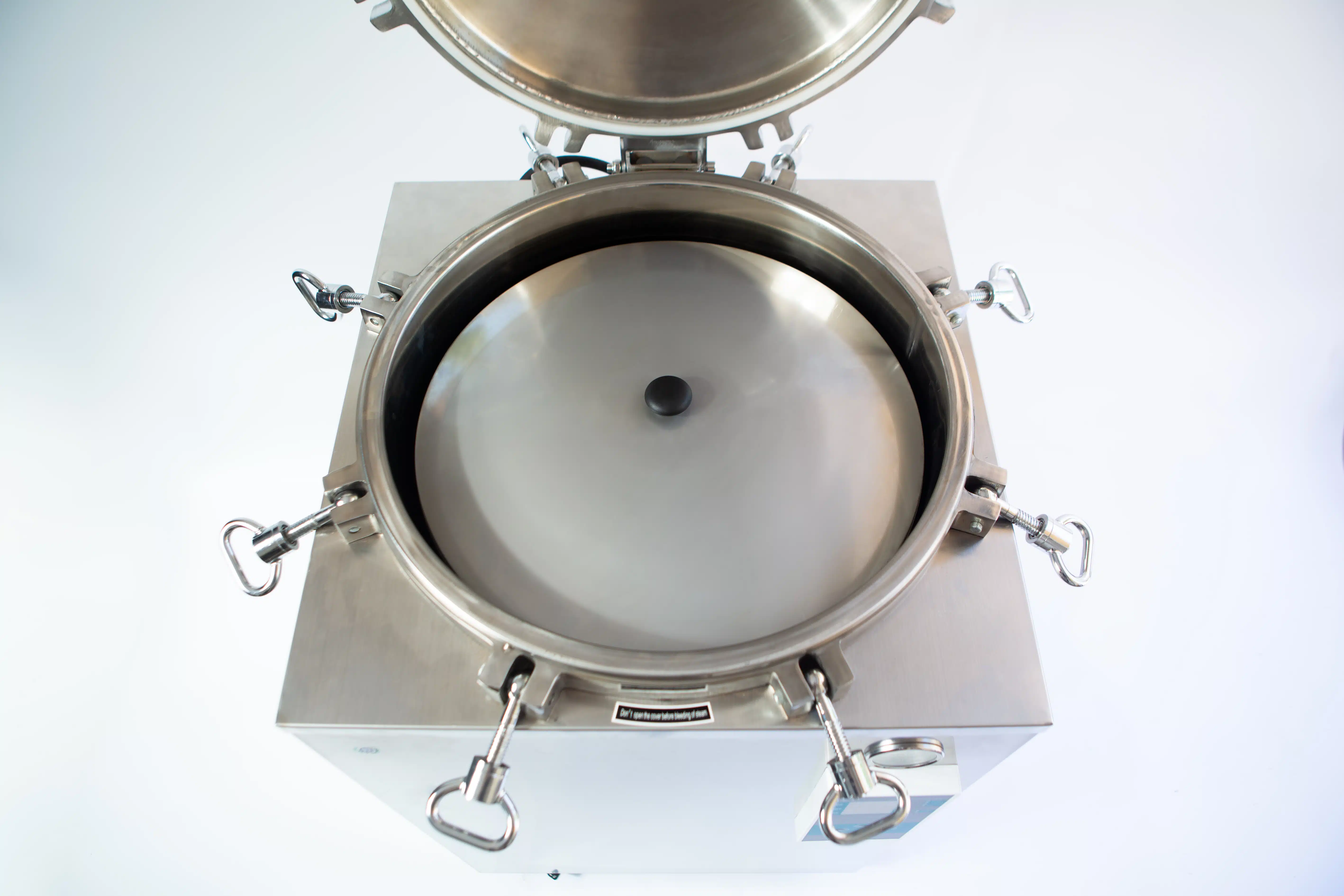 Vertical Autoclave 150 Liters (Automatic) | Commercial use | 6KW 11 Open stainless steel autoclave with lid lifted, showing the circular inner chamber and locking clips.