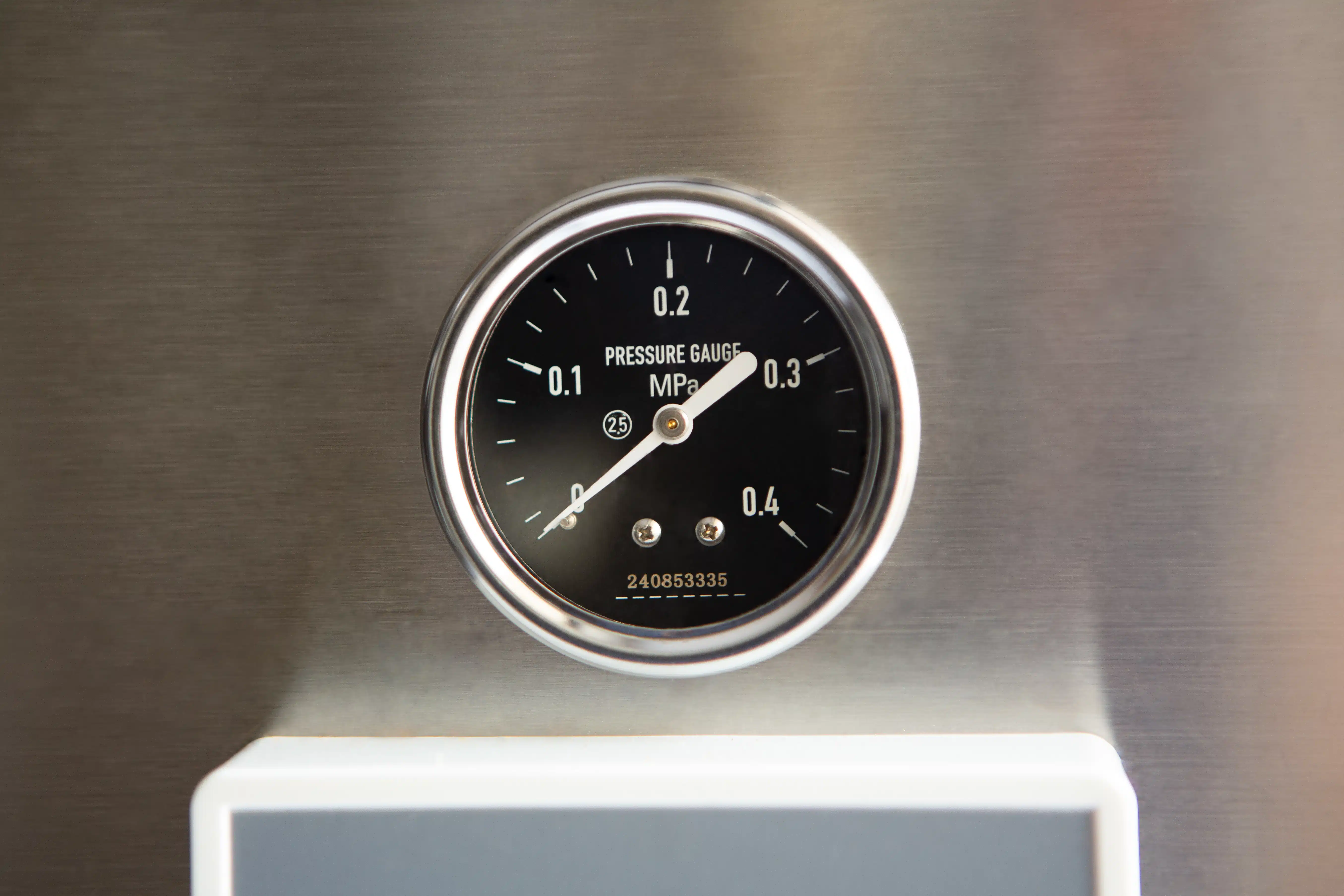 Vertical Autoclave 150 Liters (Automatic) | Commercial use | 6KW 15 A close-up of a round black pressure gauge displaying measurements in MPa on a metallic surface.