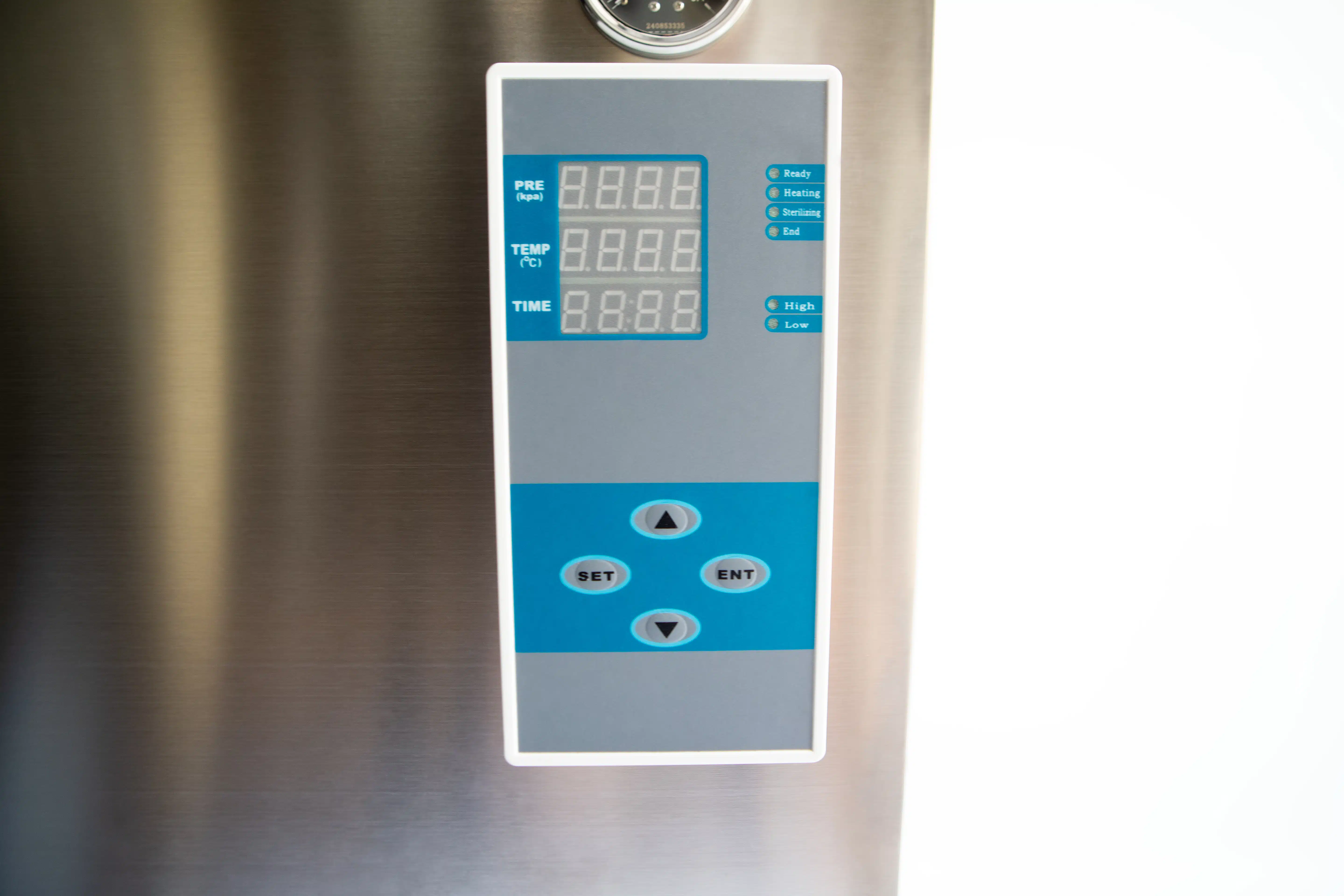 Vertical Autoclave 150 Liters (Automatic) | Commercial use | 6KW 16 Close-up of a digital control panel with display screens and arrow buttons on a stainless steel surface.