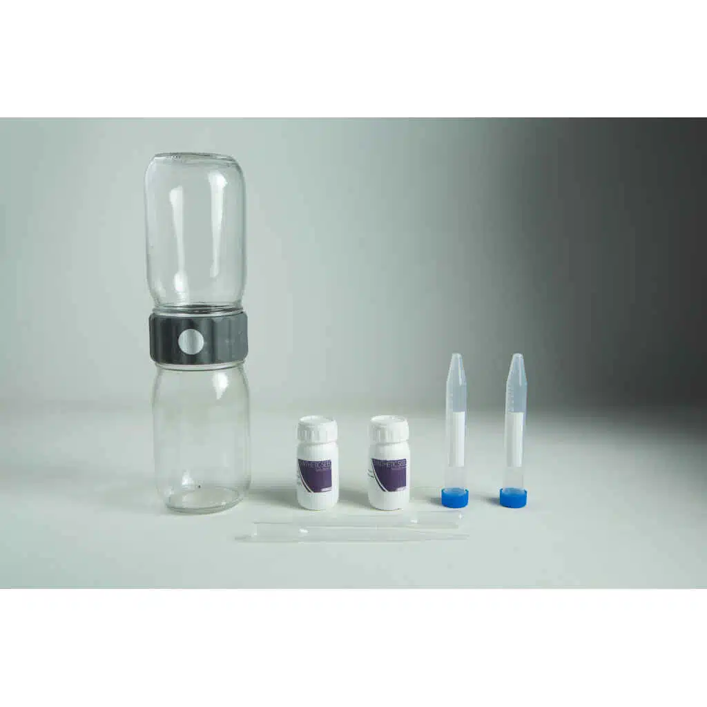 A water testing kit with bottles, vials, dropper, and containers on a grey background—ideal for use with your Plantcell Synthetic Seed Starter Kit to ensure optimal hydration and healthy plant growth.