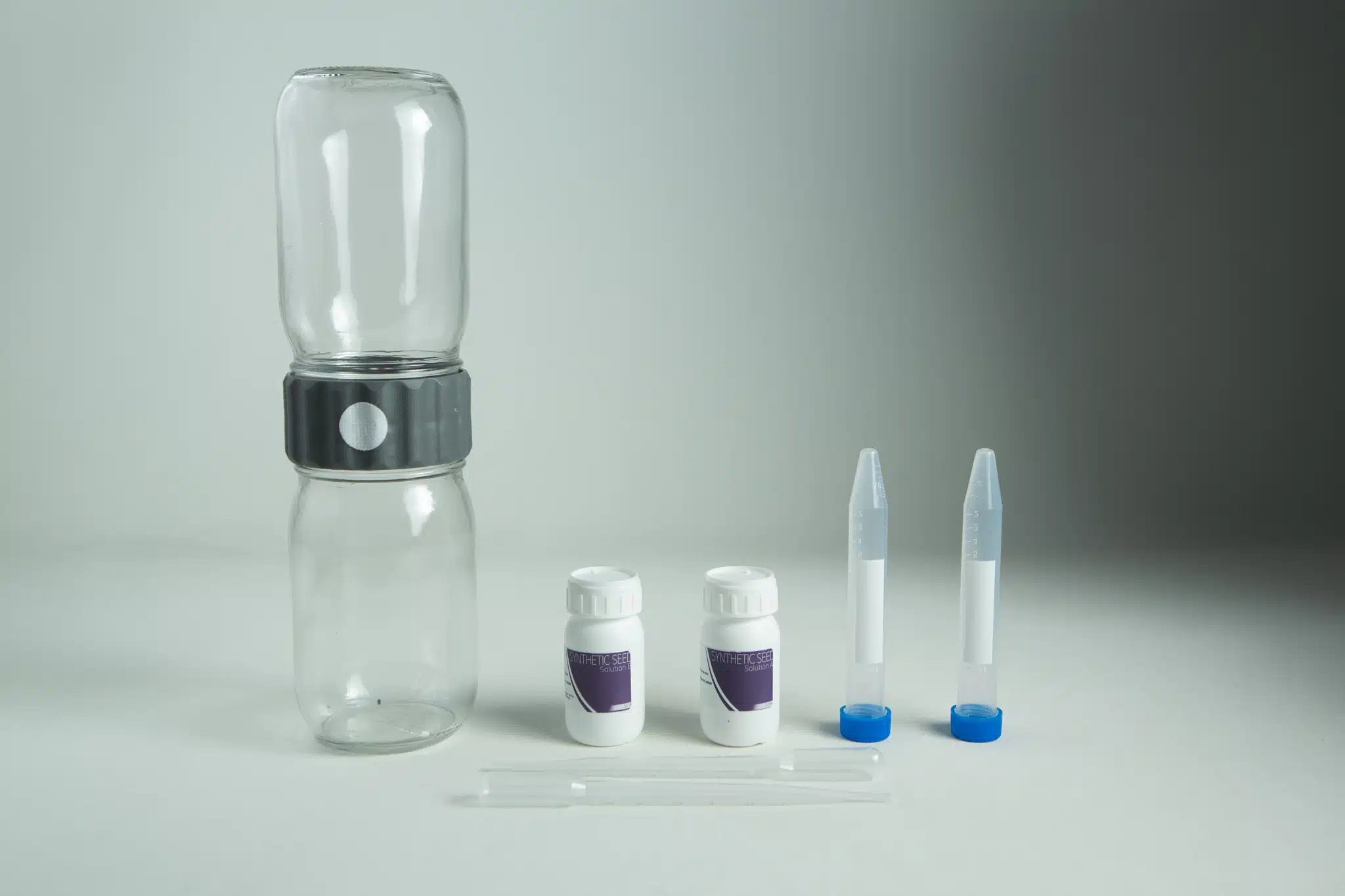 A water testing kit with bottles, vials, dropper, and containers on a grey background—ideal for use with your Plantcell Synthetic Seed Starter Kit to ensure optimal hydration and healthy plant growth.