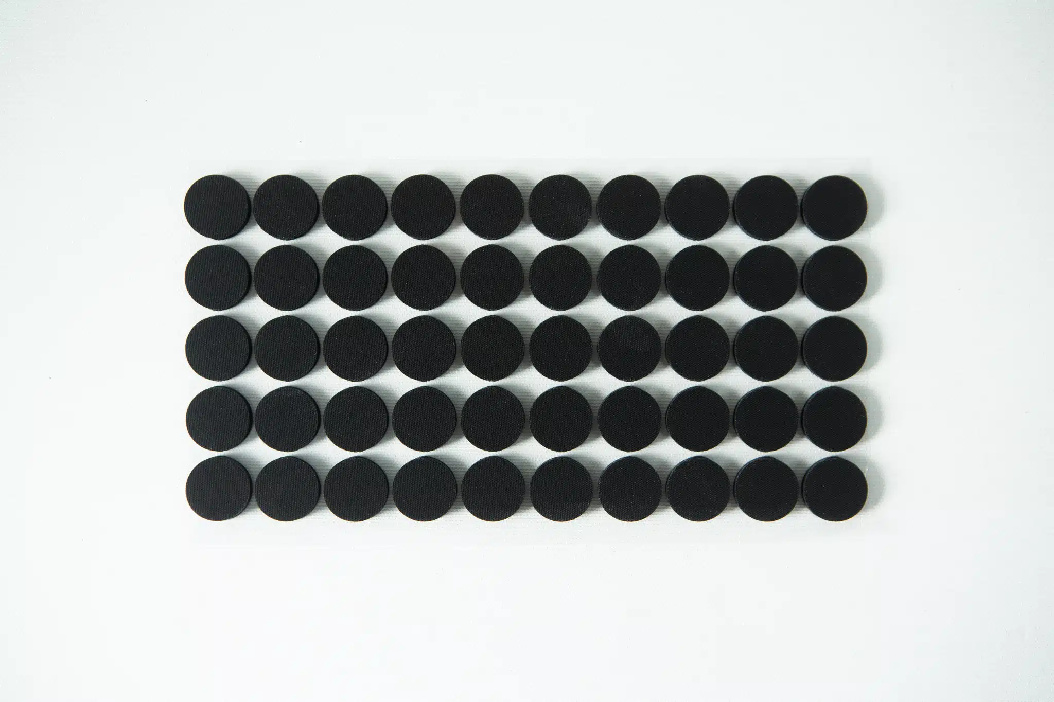 A grid of 40 black circular dots arranged in five rows on a white background.