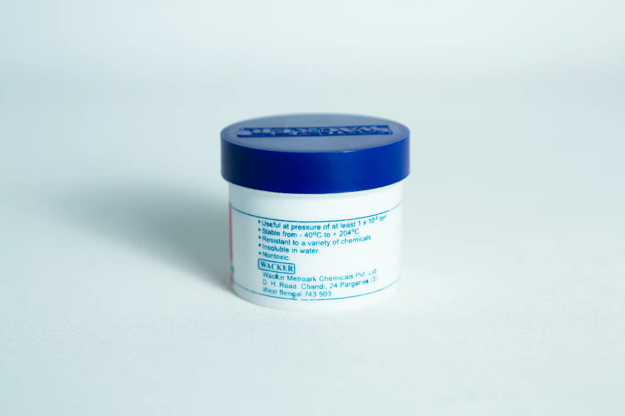 Metroark Silicone Grease Lubricant High Temp Vacuum in a small white container with a blue lid and blue text, set against a plain light background.