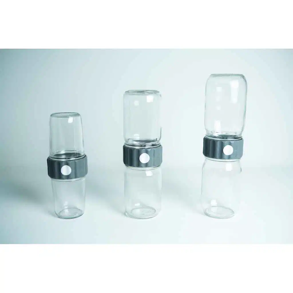 Three stacked pairs of Plant Cell Biocoupler™ Glass jars (454ml, 340ml, 227ml) joined by black lids with white buttons, arranged from left to right.