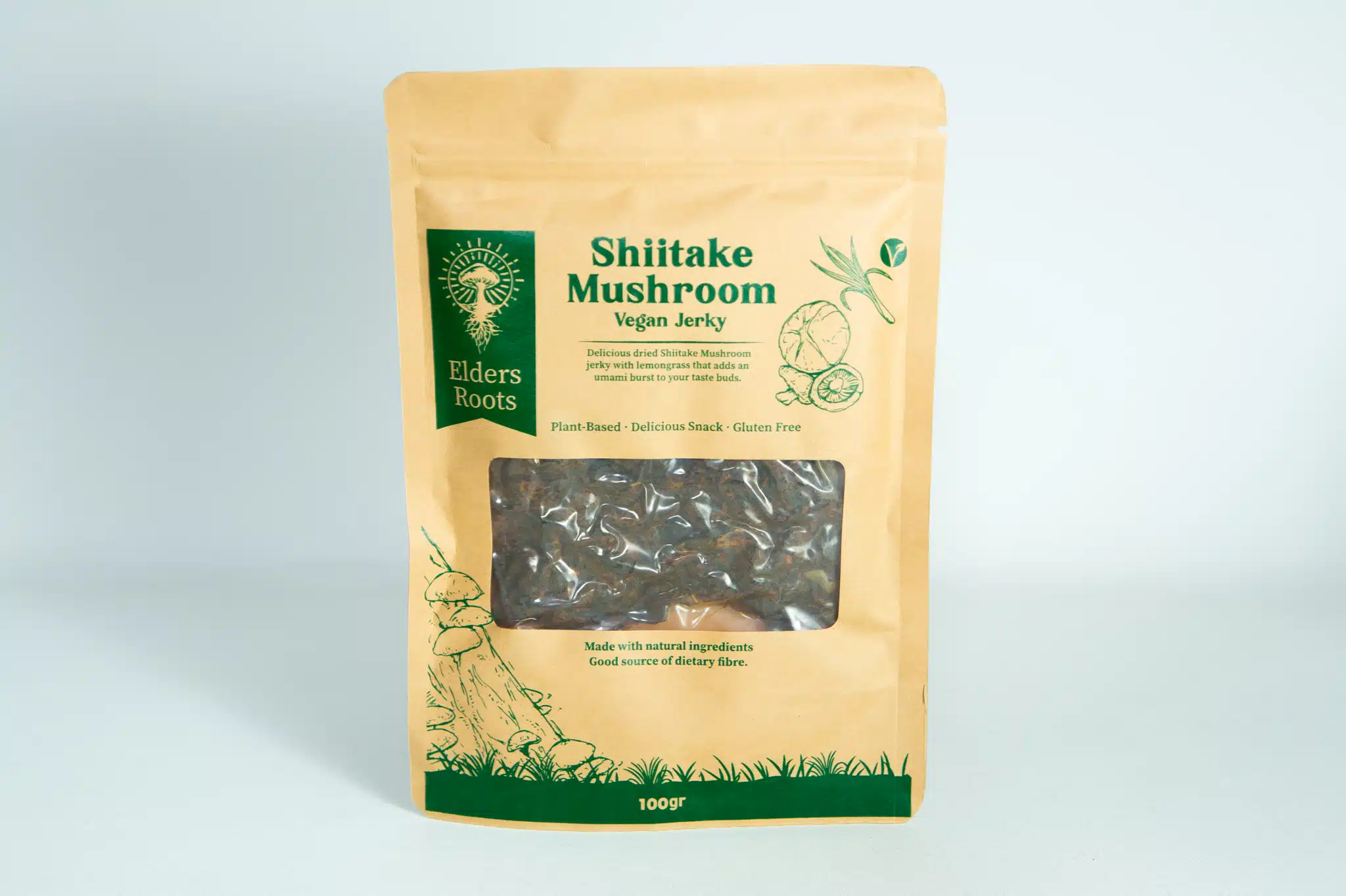 A brown bag of Elders Roots Shiitake Mushroom Floss | Vegan with a clear window and green text on the front.