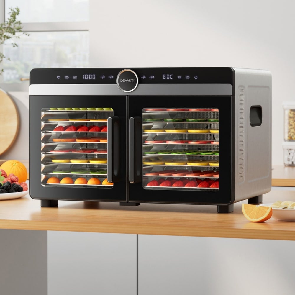 Devanti 16 Trays Food Dehydrator Dual-Zone Stainless Steel 1 The Devanti 16 Trays Food Dehydrator Dual-Zone Stainless Steel, filled with trays of sliced fruit and vegetables, sits on a kitchen worktop.